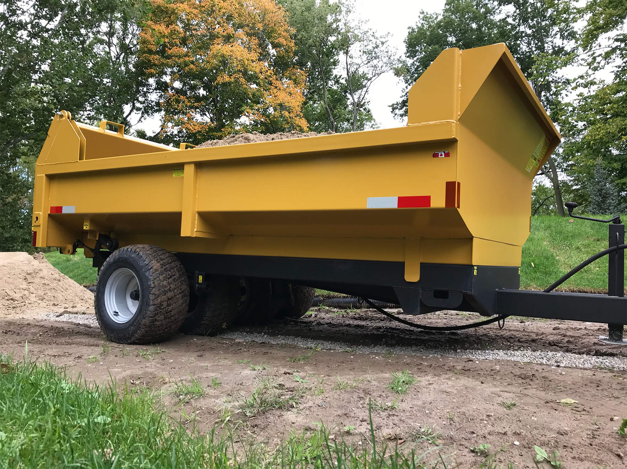 a side profile of the turf dumpster trailer